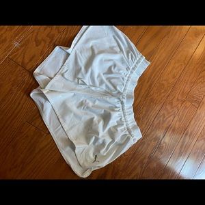 white puma athletic shorts